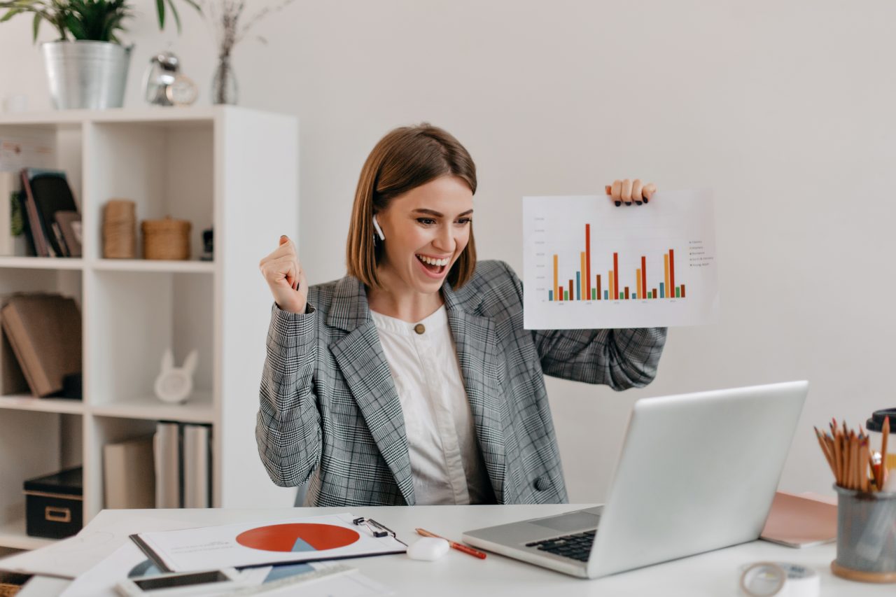 close-up-portrait-of-happy-business-woman-in-stylish-outfit-girl-in-high-spirits-demonstrates-chart-via-skype-1280x853.jpg